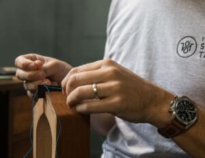 Close up of David Richards, The Strap Tailor, working on an order