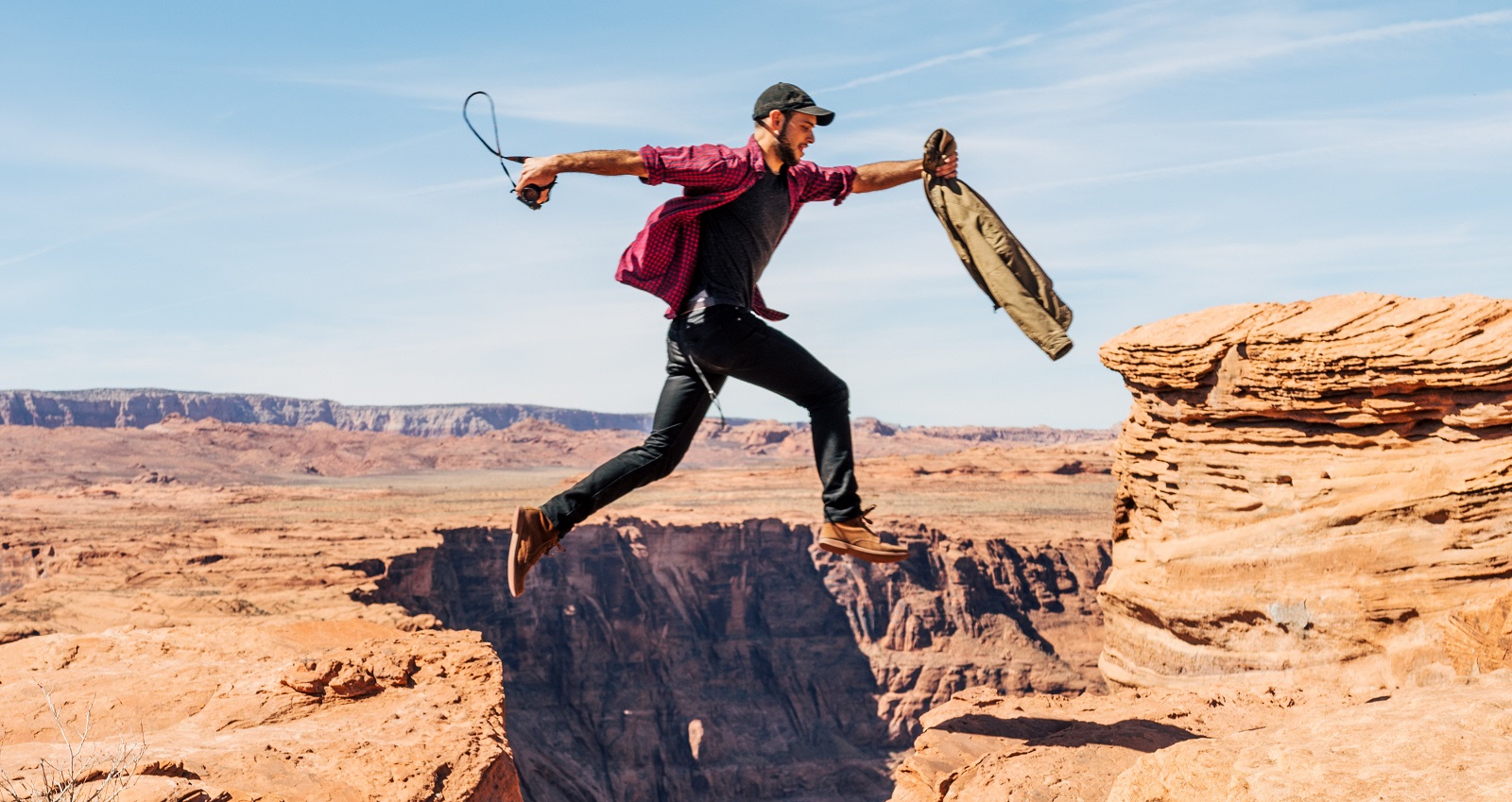 Man jumps over a ravine. Photo by Unsplash